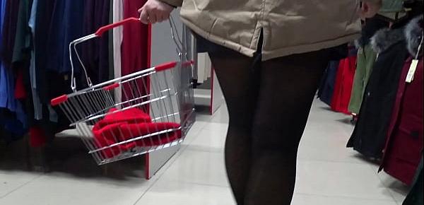  Voyeur peeks under her skirt in public. And with a hidden camera in a fitting room spies on a girl with a juicy ass in nylon tights. Foot fetish.